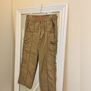 Tan cargo pants with adjustable waistband and pockets